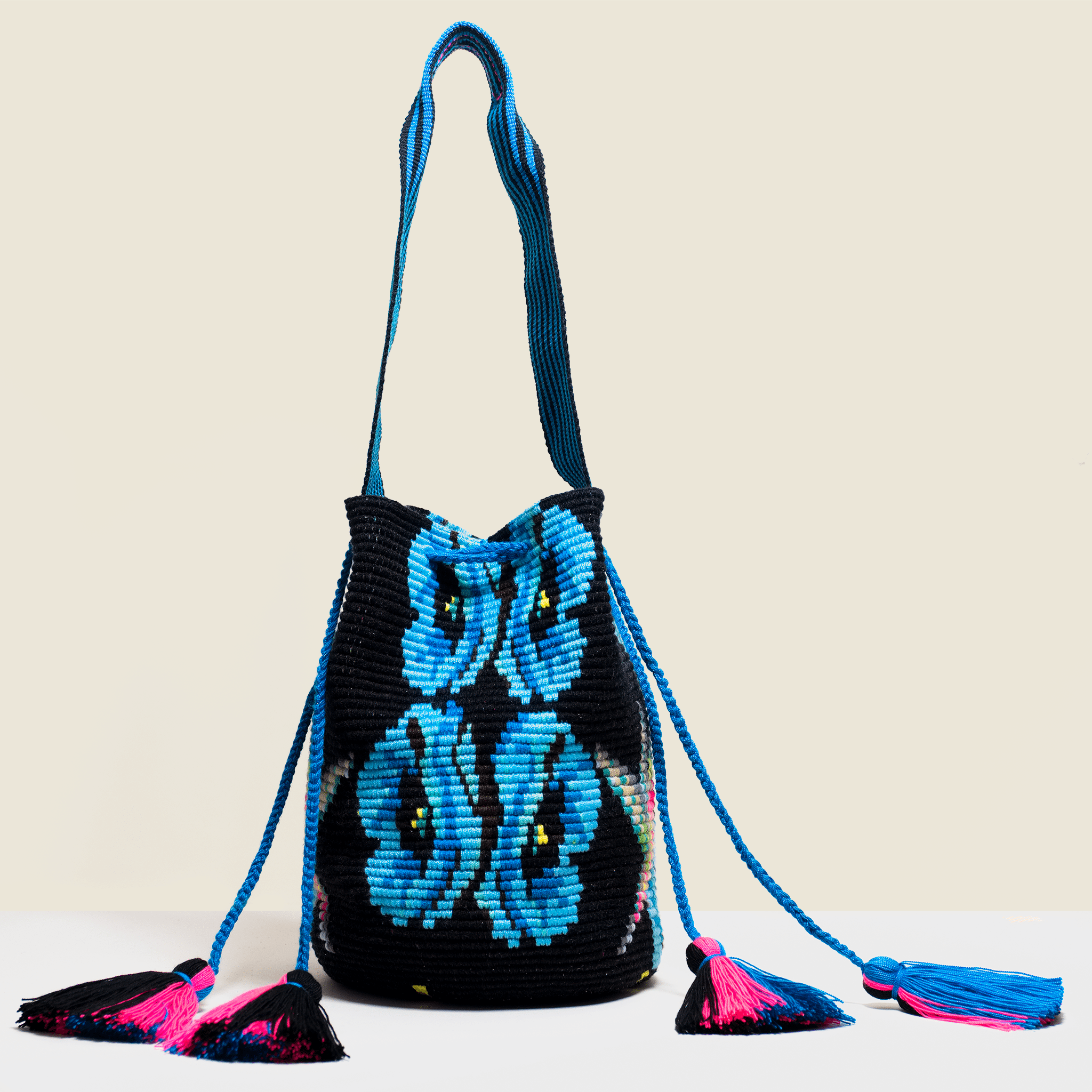 Boho chic crochet cross-body bag in black with blue flowers and pink tassels