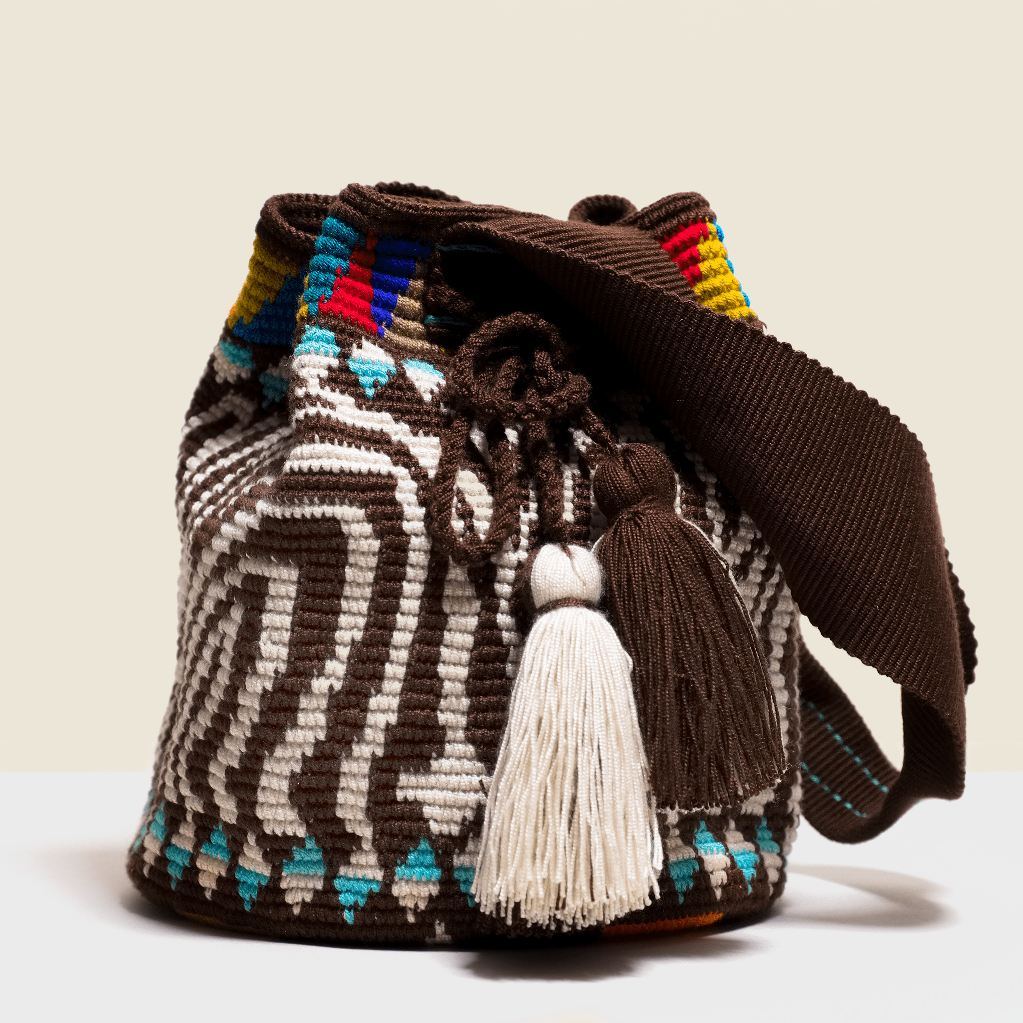 Boho chic bag with tassels. Brown and cream design 