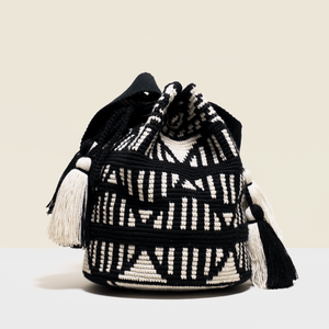 Boho chic bag in black and white geometrical design. with tassels. 